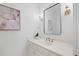 Bathroom vanity featuring elegant lighting, marble countertops, and a stylish mirror, offering a bright and modern feel at 80 Cliffcreek Trce, Atlanta, GA 30350