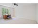 Bedroom featuring a desk, stool, and view of backyard at 80 Cliffcreek Trce, Atlanta, GA 30350