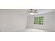 Bright bedroom featuring a ceiling fan and view of backyard at 80 Cliffcreek Trce, Atlanta, GA 30350