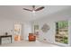 Bright bedroom with two large windows offering natural light and tree views, featuring neutral carpet at 80 Cliffcreek Trce, Atlanta, GA 30350