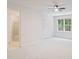 Spacious bedroom with carpet, ceiling fan, and view of backyard at 80 Cliffcreek Trce, Atlanta, GA 30350
