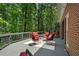 Home's deck offers great space for outdoor living among mature trees at 80 Cliffcreek Trce, Atlanta, GA 30350