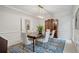 Elegant dining room features a classic hutch, modern lighting, and a stylish rug under the table at 80 Cliffcreek Trce, Atlanta, GA 30350