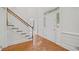 Bright foyer featuring hardwood floors, a staircase, and a front door with decorative sidelights at 80 Cliffcreek Trce, Atlanta, GA 30350