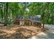 Charming single-story brick home surrounded by lush, mature trees in a peaceful setting at 80 Cliffcreek Trce, Atlanta, GA 30350