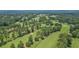 Scenic aerial view of a golf course surrounded by lush greenery and mature trees in a serene setting at 80 Cliffcreek Trce, Atlanta, GA 30350