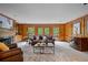 Elegant living room boasts wood paneling and fireplace at 80 Cliffcreek Trce, Atlanta, GA 30350