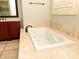 Bright bathroom with a large jacuzzi bathtub at 9695 Almaviva Dr, Alpharetta, GA 30022