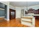 Spacious kitchen with an island, stainless steel appliances, and hardwood flooring at 9695 Almaviva Dr, Alpharetta, GA 30022