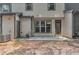Backyard view of exterior includes patio, door, window, and air conditioning unit at 109 Creighton Ln, Marietta, GA 30008