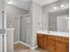 Bathroom with a glass door shower, double sinks, and wood vanity at 109 Creighton Ln, Marietta, GA 30008