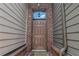 Close-up of the front door, with brickwork, wall siding, and house number 109 at 109 Creighton Ln, Marietta, GA 30008