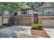 Attractive townhome with a two-car garage, brick facade, and neat landscaping at 109 Creighton Ln, Marietta, GA 30008