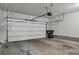 Clean garage with a white garage door at 109 Creighton Ln, Marietta, GA 30008