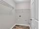 The laundry room features shelving and wood-look vinyl flooring at 109 Creighton Ln, Marietta, GA 30008