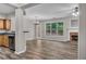 Open-concept living area with hardwood floors, fireplace, and ample natural light at 109 Creighton Ln, Marietta, GA 30008