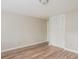 Bedroom with wood-look floors and a large closet with white doors at 110 Paddock Trl, Peachtree City, GA 30269