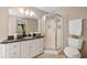 Bathroom featuring a walk-in shower, tile floors, granite countertops, and a neutral color palette at 2355 Woodland Hills Dr, Cumming, GA 30040