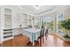 Bright dining room with built-in shelving and large windows at 2355 Woodland Hills Dr, Cumming, GA 30040