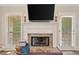 Close up of the fireplace featuring stone details and a decorative mantel at 2355 Woodland Hills Dr, Cumming, GA 30040