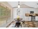 Eat-in kitchen featuring a round table, stainless appliances, natural light and white cabinets at 2355 Woodland Hills Dr, Cumming, GA 30040