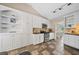 Well-equipped kitchen with white cabinets, stainless steel appliances, and ample storage at 2355 Woodland Hills Dr, Cumming, GA 30040