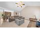 Spacious living room featuring a cozy seating area and stone accent wall in the loft at 2355 Woodland Hills Dr, Cumming, GA 30040