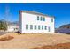 New construction backyard with a spacious lawn ready for landscaping at 1712 Fulmont Cir, Mableton, GA 30126