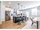 A modern kitchen with a large island, stainless steel appliances, and a dining area at 1712 Fulmont Cir, Mableton, GA 30126