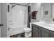 Clean bathroom featuring a shower-tub combo, updated vanity, and modern fixtures at 2022 Bixby Byway Se Rd, Atlanta, GA 30317