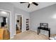 Cozy bedroom space with walk-in closet, desk, and overhead ceiling fan at 2022 Bixby Byway Se Rd, Atlanta, GA 30317