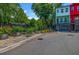 Brightly painted modern townhomes with garage parking and flower boxes at 2022 Bixby Byway Se Rd, Atlanta, GA 30317