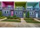 Stylish townhome complex with colorful facades, front balconies, and manicured landscaping at 2022 Bixby Byway Se Rd, Atlanta, GA 30317