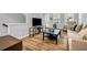 Comfortable living area with hardwood floors, a sleek entertainment unit, and abundant natural light from the windows at 2022 Bixby Byway Se Rd, Atlanta, GA 30317