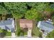 An aerial view shows the house, mature trees, and manicured lawn at 457 Skiles Ct, Suwanee, GA 30024