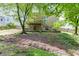 The home has a spacious backyard featuring a deck, stairs, and mature trees that provide shade at 457 Skiles Ct, Suwanee, GA 30024