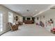 Spacious basement with neutral carpet, plush seating, a large television and lots of entertaining space at 457 Skiles Ct, Suwanee, GA 30024