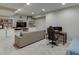 Finished basement features a living area with a tv and an office area at 457 Skiles Ct, Suwanee, GA 30024