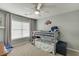 Bedroom featuring bunk beds with a ceiling fan and neutral walls at 457 Skiles Ct, Suwanee, GA 30024