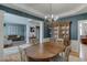Open dining area featuring hardwood floors and views of living room at 457 Skiles Ct, Suwanee, GA 30024