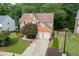 Traditional two-story brick home featuring a two-car garage and well-manicured landscaping at 457 Skiles Ct, Suwanee, GA 30024