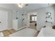 Spa-like main bathroom showcasing a glass shower, soaking tub, and access to the main bedroom at 457 Skiles Ct, Suwanee, GA 30024