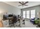 Spacious office area with ample natural light, multiple monitors, and a comfortable seating area at 457 Skiles Ct, Suwanee, GA 30024