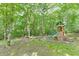 A backyard play area features a wooden playset with slide and climbing wall, perfect for outdoor fun at 457 Skiles Ct, Suwanee, GA 30024