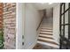 Bright entryway featuring stairs, stone accent wall and ample natural light at , Atlanta, GA 30342
