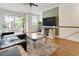Cozy living room with plush rug, large windows, and stylish decor at , Atlanta, GA 30342