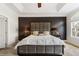 Main bedroom showcasing neutral décor, tray ceiling, lamps on the nightstands, and two large windows at , Atlanta, GA 30342