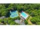 Enjoy community amenities: pool, tennis courts, parking, all set amidst lush greenery at 120 Ashewoode Downs Ln, Alpharetta, GA 30005