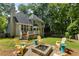 Spacious backyard with a patio, fire pit, and plenty of room for outdoor activities at 120 Ashewoode Downs Ln, Alpharetta, GA 30005