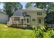 Charming home featuring a spacious deck, well-maintained lawn, and mature trees at 120 Ashewoode Downs Ln, Alpharetta, GA 30005